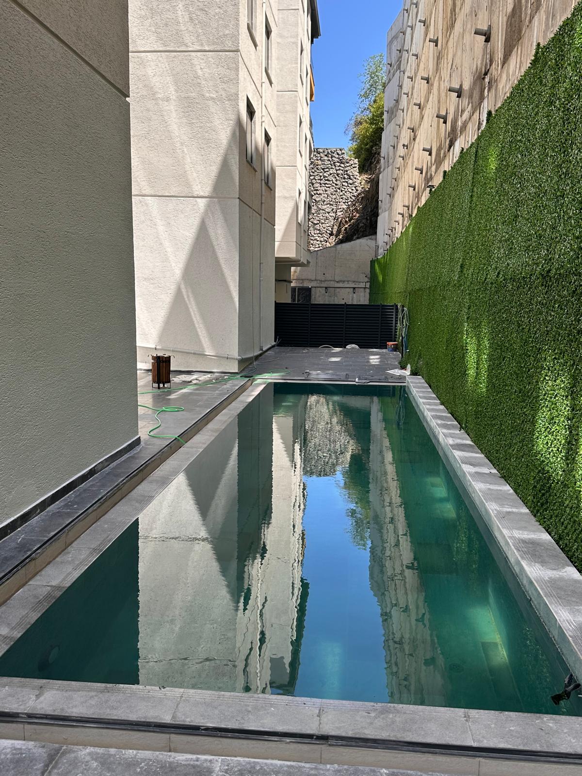 ÇARŞI EMLAK'TAN KEMER MEVKİ YENİ YAPI HAVUZLU SATILIK 1+1 DAİRE